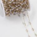 Bohemian gold plated copper chain with milky white beads on a professional white spool - Gold Chain - Transparent Blue
