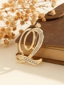 Elegant gold-tone letter Q brooch pin with sparkling rhinestones on vintage book - Gold Letter Q