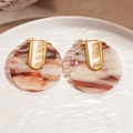 Detailed macro view of 18k gold-plated U-shaped earrings with brown marble resin texture - Brown & White Marble