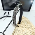Braided wide headband with dark rhinestones on a decorative box and straw mat - Mineral Grey