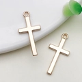 Rose gold cross pendants for DIY jewelry making on white ceramic plate with green leaf - 1 Piece/Pack (13x27mm)