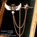 Detailed view of enamel owl brooch with gold star charm and double fringe chains - Gold Owl Star Style (TL24055)