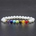 White beaded seven chakra stone bracelet with golden spacers and volcanic rock detail - Porcelain White Colorful Chakra Bracelet