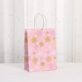 Pink Christmas kraft paper gift bag with glitter snowflakes and candy cane patterns - Snowflake Candy