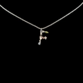 Silver letter F necklace with colorful gemstones and cubic zirconia on black background - Letter F / Silver