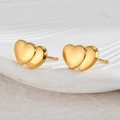 Macro shot of minimalist gold double heart earrings with polished metallic luster - Double Layer Heart / Gold