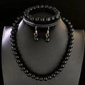 Polished black bead jewelry set featuring necklace, bracelet and earrings with gold hooks - Gold Black