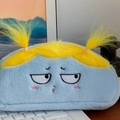 Funny blue plush pencil case with yellow pigtails and embroidered grumpy expression - Yellow Hair
