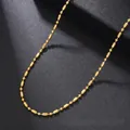 Detailed close-up of a gold-plated stainless steel barrel bead chain on a black display - Bamboo Bead Chain