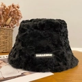 Plush black winter bucket hat with Doraemon label in a cozy home setting - Black Label Fisherman-Black