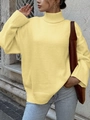 Women's yellow oversized turtleneck sweater with ribbed cuffs on a stone wall background - S / Light Yellow