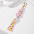 Handmade woven daisy flower keychain with macrame tassels in pastel colors - Pink Floral