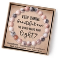Detailed macro view of Pink Zebra Jasper bead bracelet in gift box with sunstone - Pink Zebra + Sunstone + Card