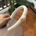 Close-up of beige woven headband with seashell, starfish decorations and faux pearls - White - Linen Texture Pearl Starfish Headband