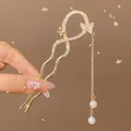 Golden butterfly hair pin with cascading tassels and pearls in a refined vintage style - Butterfly Winding Tassel