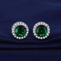 Classic silver stud earring featuring a round emerald green zircon on blue fabric - Round Halo Green Zirconia Studs (ED80)