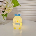 Cute yellow chicken night light with blue bow accessory emitting soft warm glow - Meow Chick - Blue - Blue Ribbon