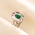 Detail of silver stainless steel ring featuring oval green malachite on textured fabric - Silver-Green (Malachite)