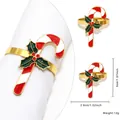 Golden candy cane Christmas napkin ring with green holly leaves on white cloth - Candy Cane Holly (73)