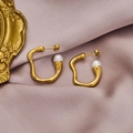 Elegant gold irregular hoop earrings with white pearls on a soft silk fabric background - 1309-Gold Irregular Pearl