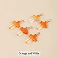Translucent orange and white gradient glass cross pendant with golden metal clasp - 25x18x4mm / Orange White