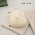 Creamy white heart-shaped floral relief scented candle on a rustic stone tray - Floral Stacked Heart(79) / Cream White