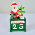 Green wooden Christmas countdown calendar with Santa Claus and December 25 blocks - Santa Claus
