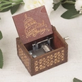 Brown wooden hand-cranked music box with Happy Birthday carving and floral patterns - Brown