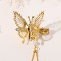 Elegante pinza para el pelo de mariposa dorada con borlas de perlas y alas de metal - Dorado