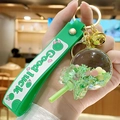 Green quicksand ball keychain with Good Luck wristlet and gold metal clasp - Bead Lollipop - Green