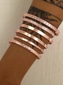 Stackable seven-piece rose gold multi-layered bangle set with engraved geometric patterns - Rose Gold Letter Arrow Open 7-Piece Set (DZ-353)