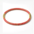 Detail view of red enamel and gold bamboo-textured stainless steel bangle clasp - Rose Gold
