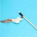 Wooden cat wand with natural feathers, bell, and linen bird pendant on blue background - Linen Chick