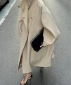 Detail of the minimalist long beige trench coat with stand collar and sleek silhouette - S / Apricot