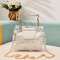Transparent daisy print tote bag with golden cat-ear handles and cream inner pouch - White