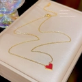 Elegant gold-tone chain necklace featuring a red heart-shaped enamel pendant in a jewelry box - X661 Red Enamel Heart