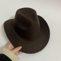 Classic dark brown felt western cowboy hat with wide brim and matte wool texture - Coffee