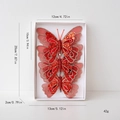 Three red sequined Christmas feather butterflies in a white gift box with metal clips - Style G