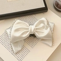 Elegant ivory silk bow hair claw with pearl trim and gold chain detail - White Pearl Bow Hair Claw