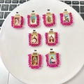 Detail view of eight rectangular religious pendants with pink beads and golden frames - Rose Red