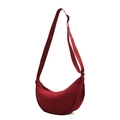 Casual red canvas crescent crossbody bag with adjustable wide strap on white background - Burgundy
