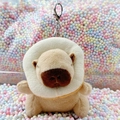 Plush capybara keychain with white toast collar on a colorful foam ball background - Donut Light Brown + Silver Clip