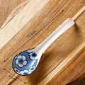 Japanese ceramic soup spoon with blue floral pattern and 15.5cm length on wood - Blue Border Lattice