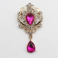 Vintage gold brooch with clear crystals and a large pink teardrop gemstone accent - Rose Red
