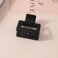 Minimalist square matte black claw clip for women displayed on a neutral desk - Bulk Packaging / Black