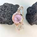 Detail of rose gold bracelet watch featuring a pink gradient dial and diamond accents - Pink