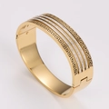 Gold wide hollow Greek meander pattern bangle with pavé crystal accents in 45-degree view - Gold