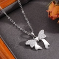 Close-up of bowknot necklace with zircon inlay on velvet cushion inside a jewelry box - Silver Diamond Inlaid Polished Bowknot Necklace