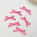Top view of six pink ribbon bow hair clips scattered on a clean white surface - Rose Red (6 Pack)