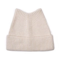 Close-up of cream white cat ear knit hat with detailed ribbed texture for winter warmth - Beige